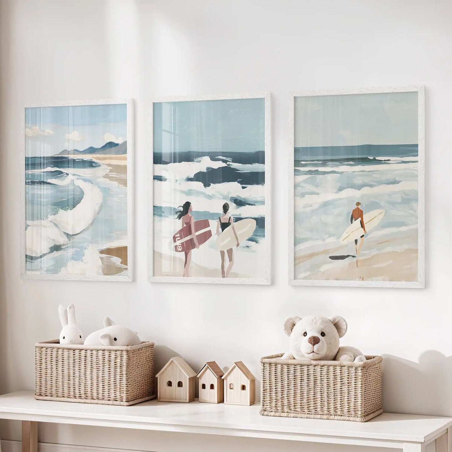 Beach coastline wall art trio in white frames, positioned over a toy storage bench to bring a breezy note to the children’s room.