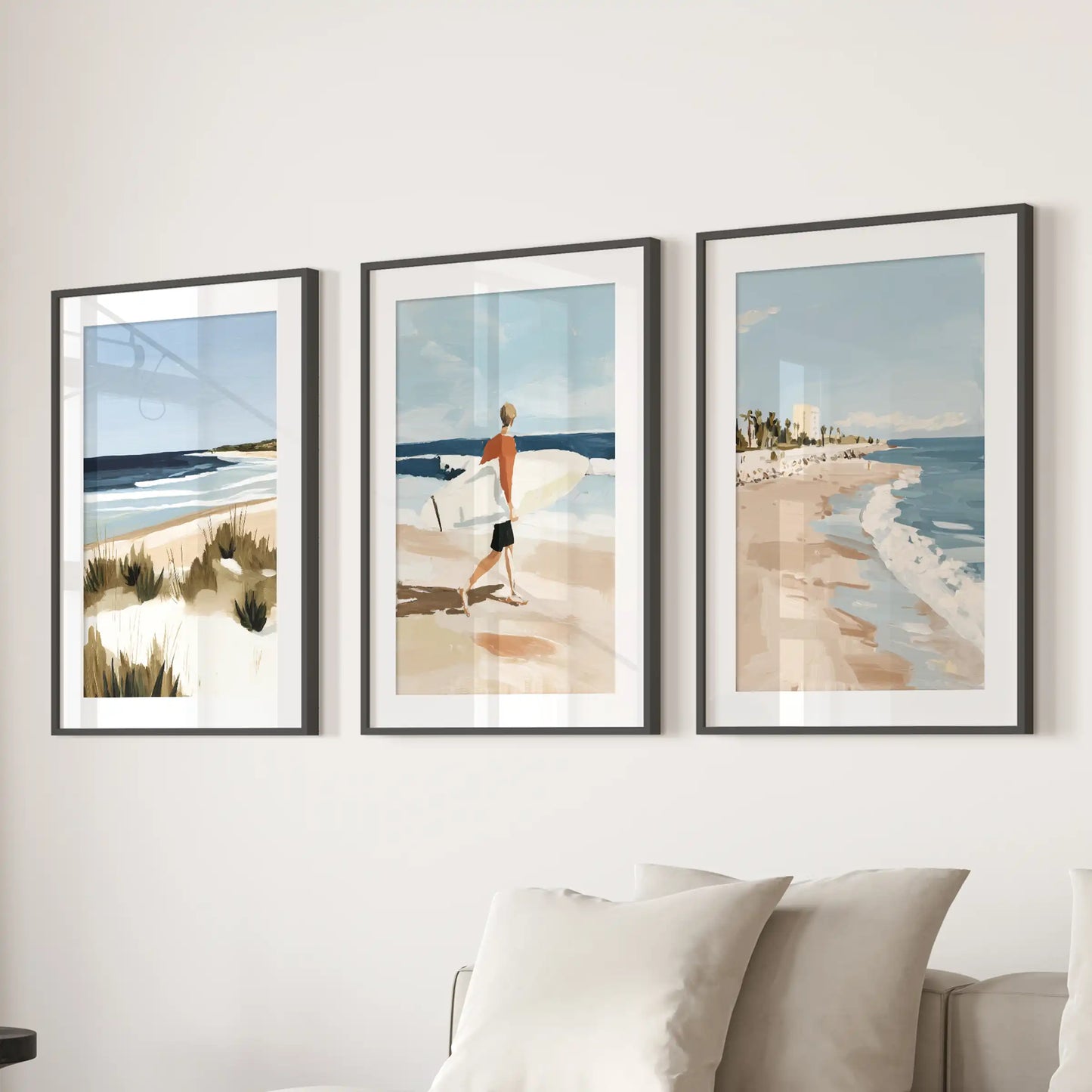 Black-matted surfer posters, a set of three, hang above the lounge sectional and create a laid-back beach energy in the space.