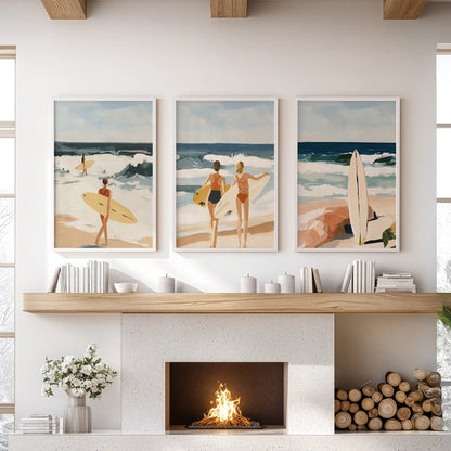 A three-panel beach scene in white frames rests above the lounge mantelpiece, carrying soft surf movement across the hearth.