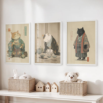 In the playroom, three bright white cat prints depicting a tea ceremony line the wall above toy storage, quietly whimsical yet calm.