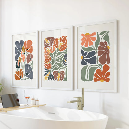 Minimalist plant wall art, a three-piece picture set in white frames, brings spa-calm terracotta notes to the bathroom wall over the bathtub.