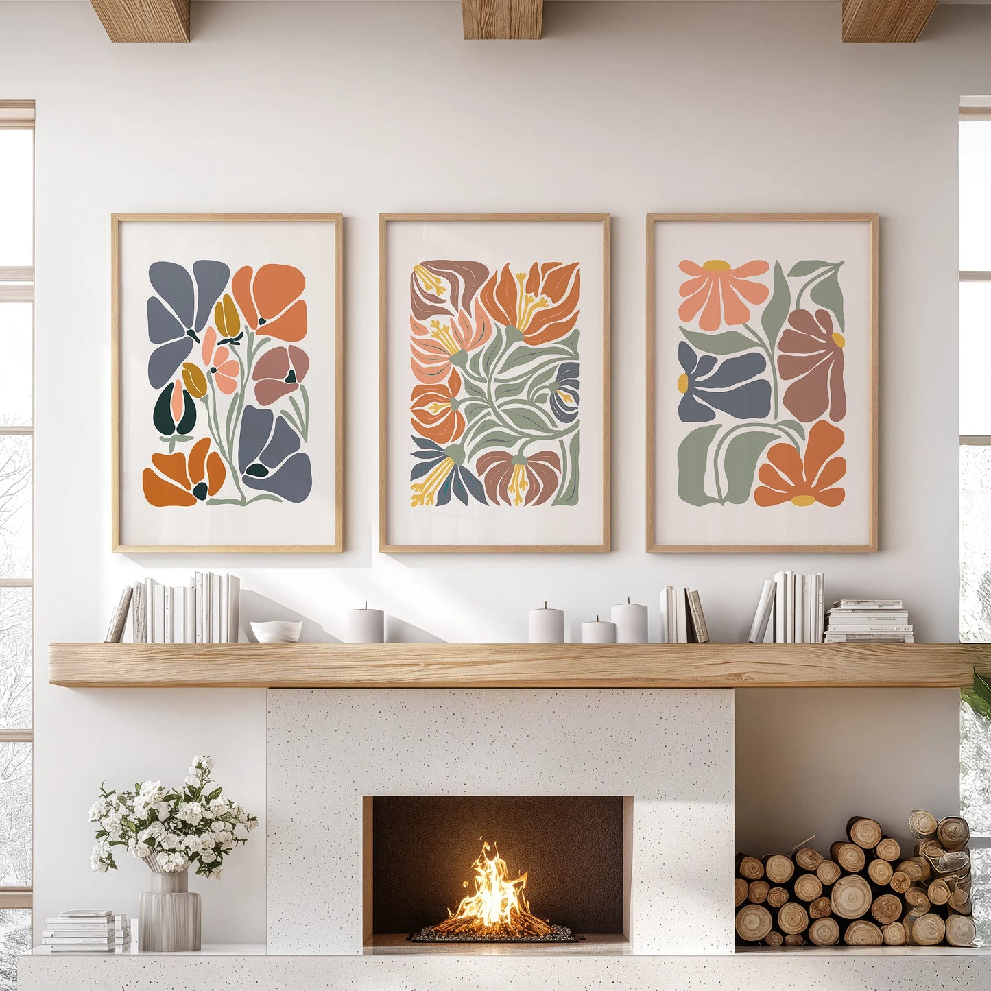 Three terracotta market prints framed in natural oak ground the family-room mantel wall with earthy bloom and curated ease.