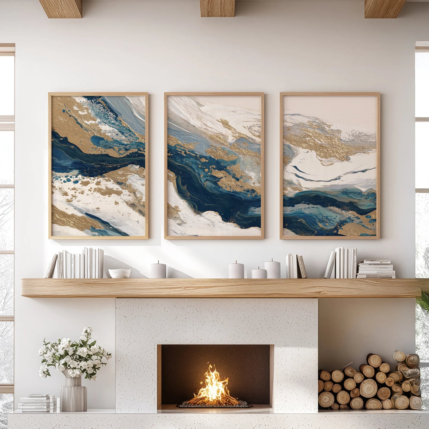 Three oak-framed pieces with blue and beige color fields warm the living room wall above the fireplace, lending quiet texture and tone.