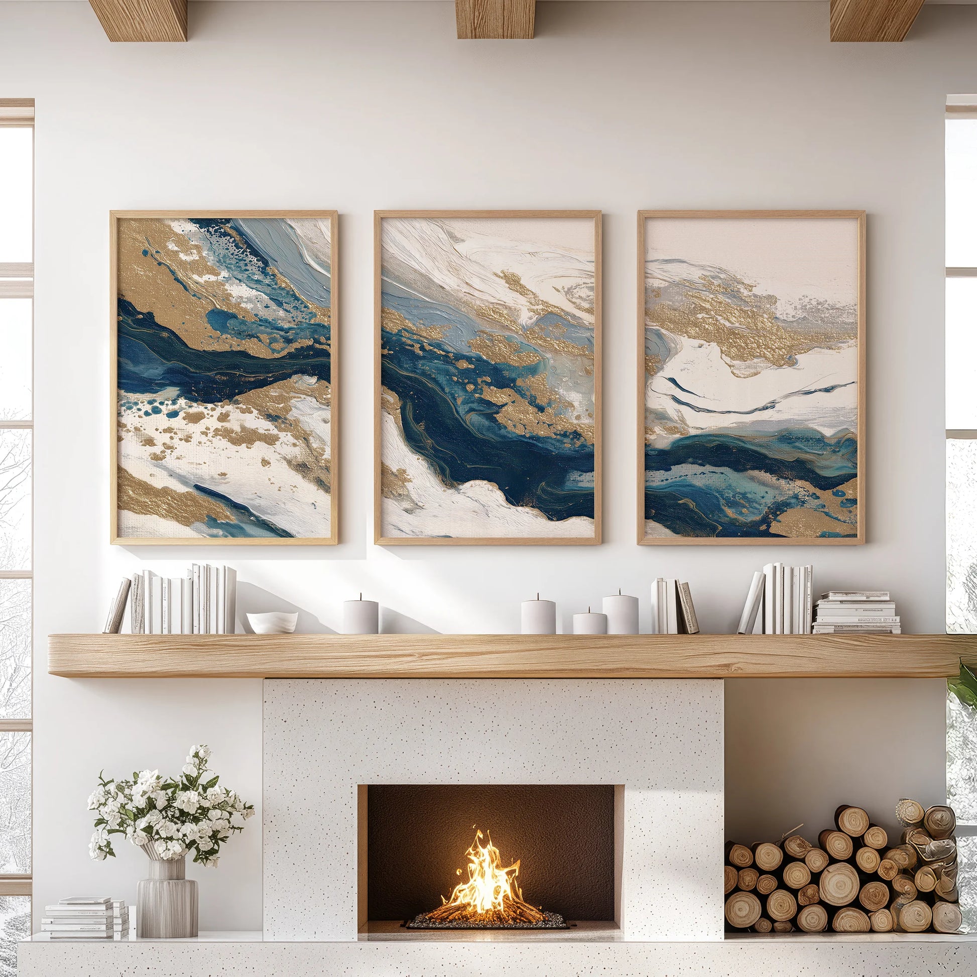 Three oak-framed pieces with blue and beige color fields warm the living room wall above the fireplace, lending quiet texture and tone.
