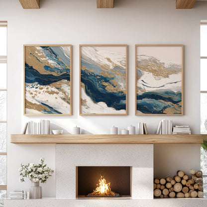 Three oak-framed pieces with blue and beige color fields warm the living room wall above the fireplace, lending quiet texture and tone.