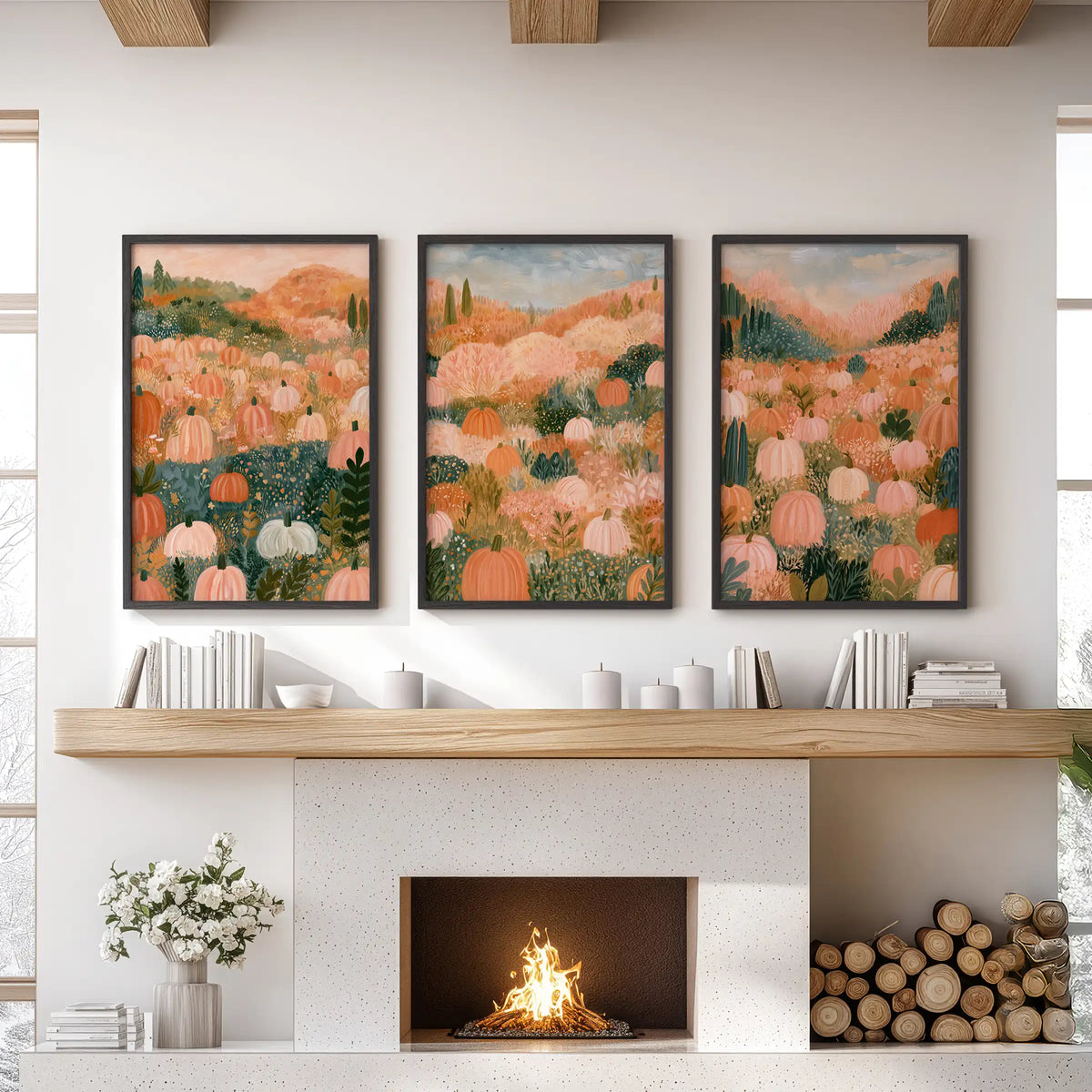Pastel pumpkin field wall art trio in black frames anchors the sitting room, hanging over the mantle with gentle autumn color and a relaxed farmhouse feel.