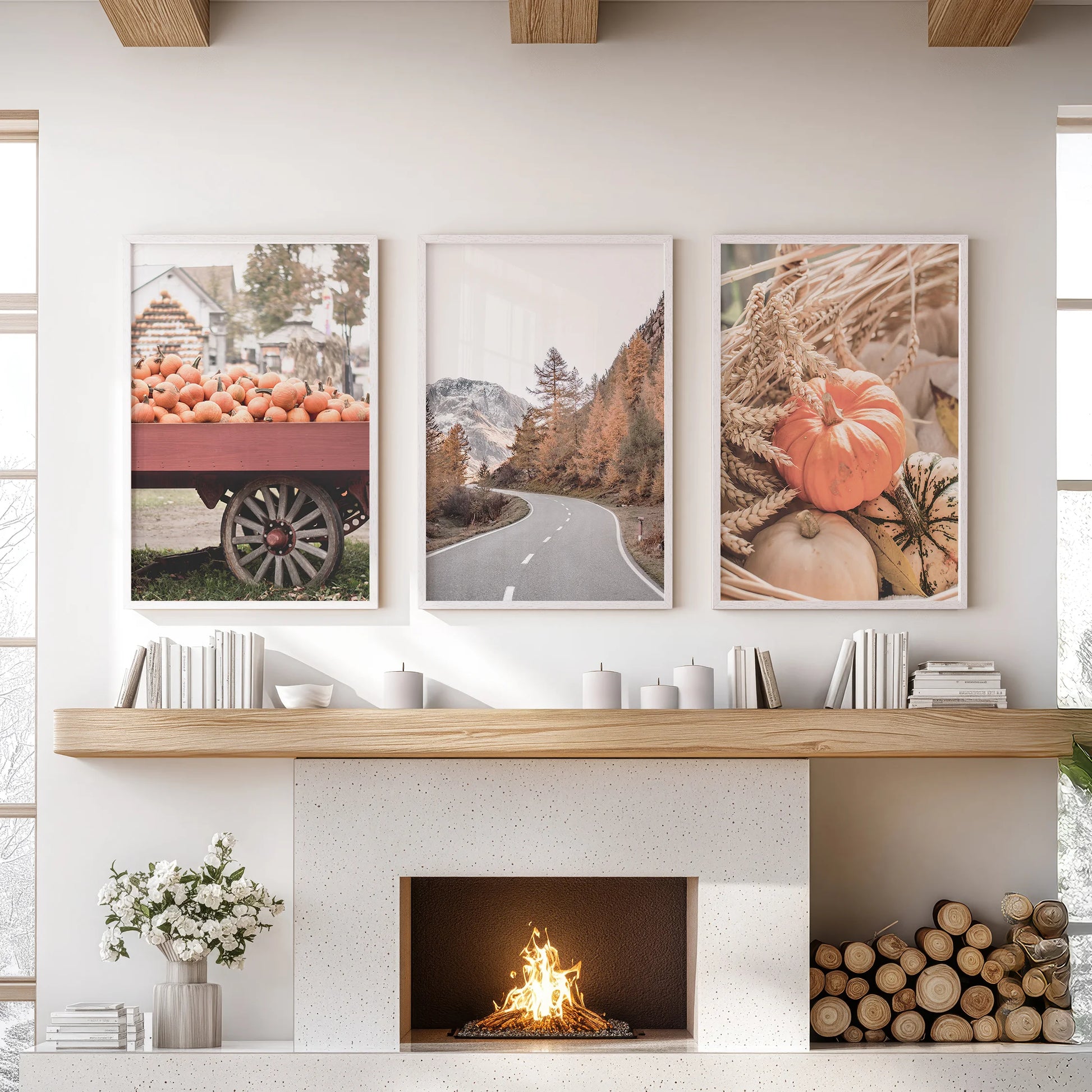 A fall farmhouse scene in three white-framed decor pieces hangs over the living room mantel, blending harvest warmth with uncluttered charm.