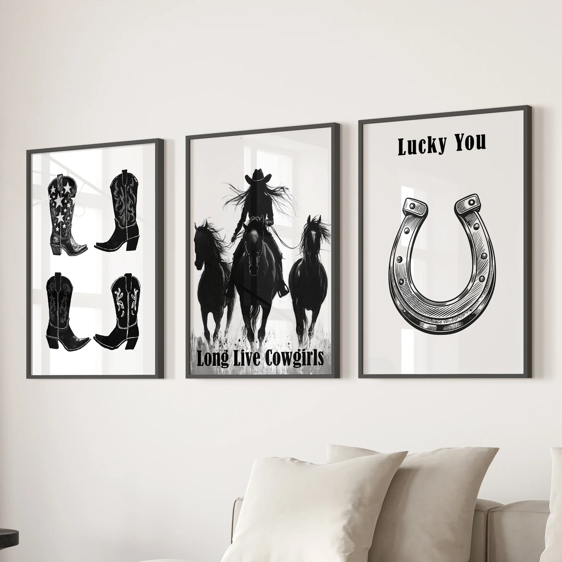 Large Western-style prints reading “Long Live Cowgirls” form a trio of wall art above the sectional, sleek in matte black frames.