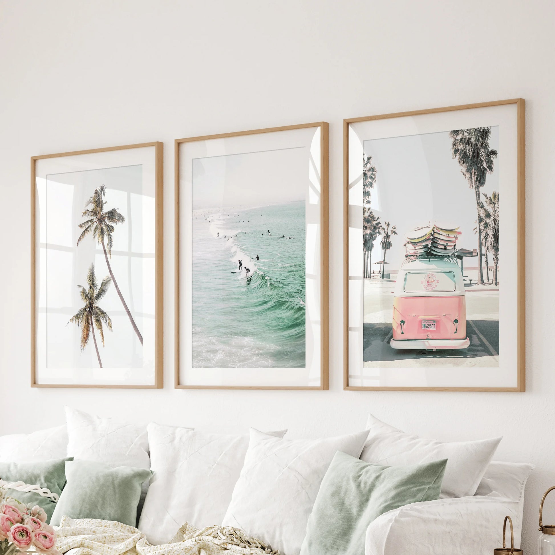 Rolling ocean surf wall art in three pieces softens the bedroom, presented as gallery-wrapped canvases above the bed headboard.