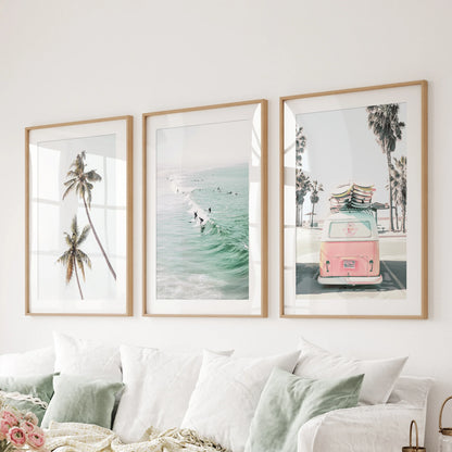 Rolling ocean surf wall art in three pieces softens the bedroom, presented as gallery-wrapped canvases above the bed headboard.