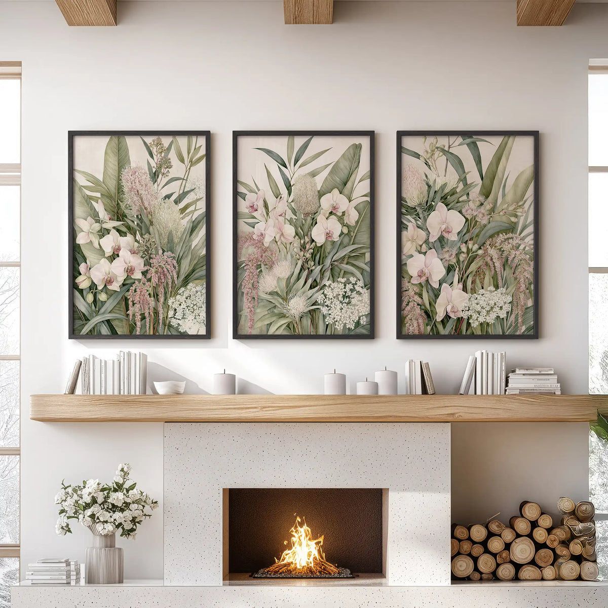 Three pink orchid and foliage prints in black frames above a fireplace.