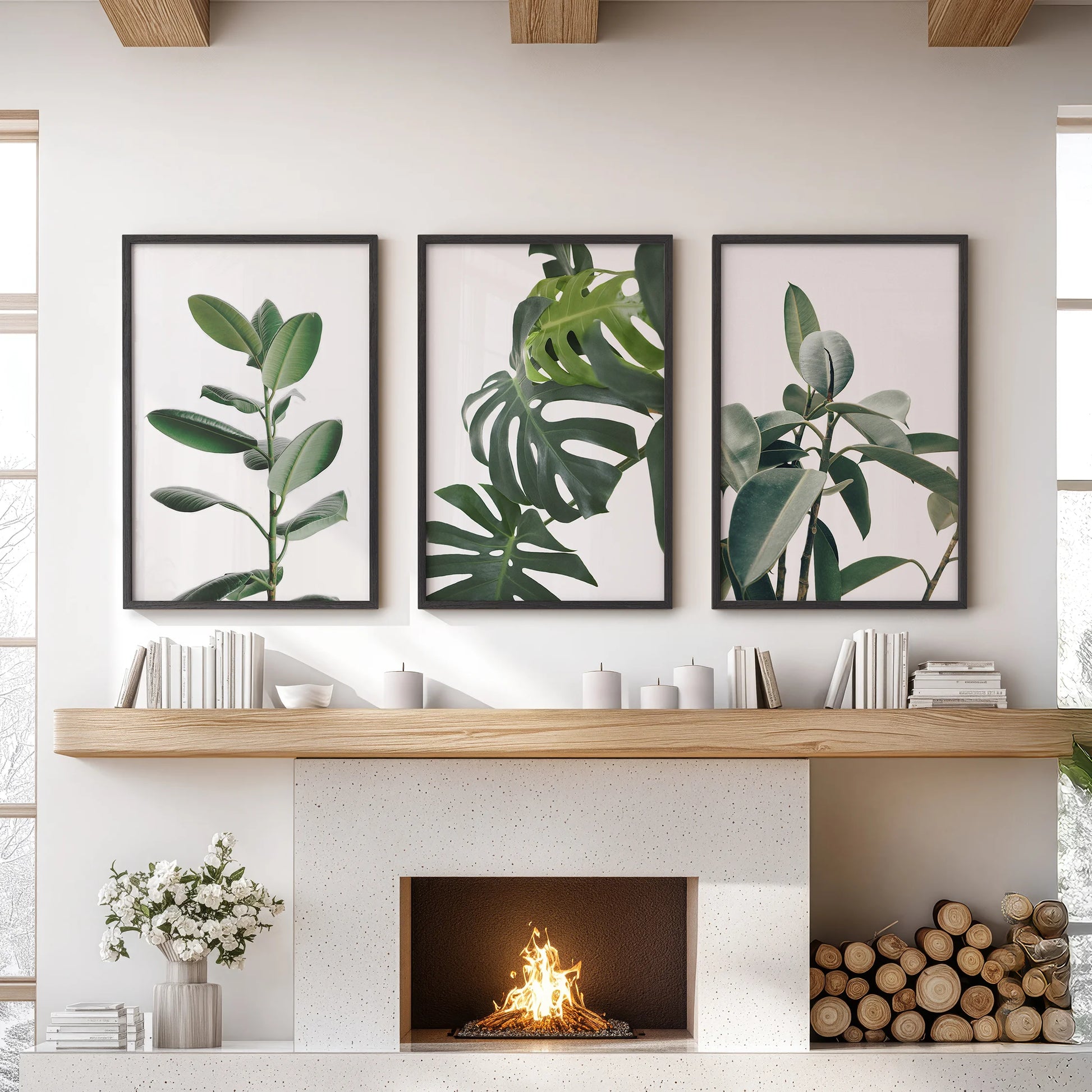 A trio of black-framed tropical leaf posters hangs over the family room mantel, giving the wall art a fresh, modern burst of lush green texture.