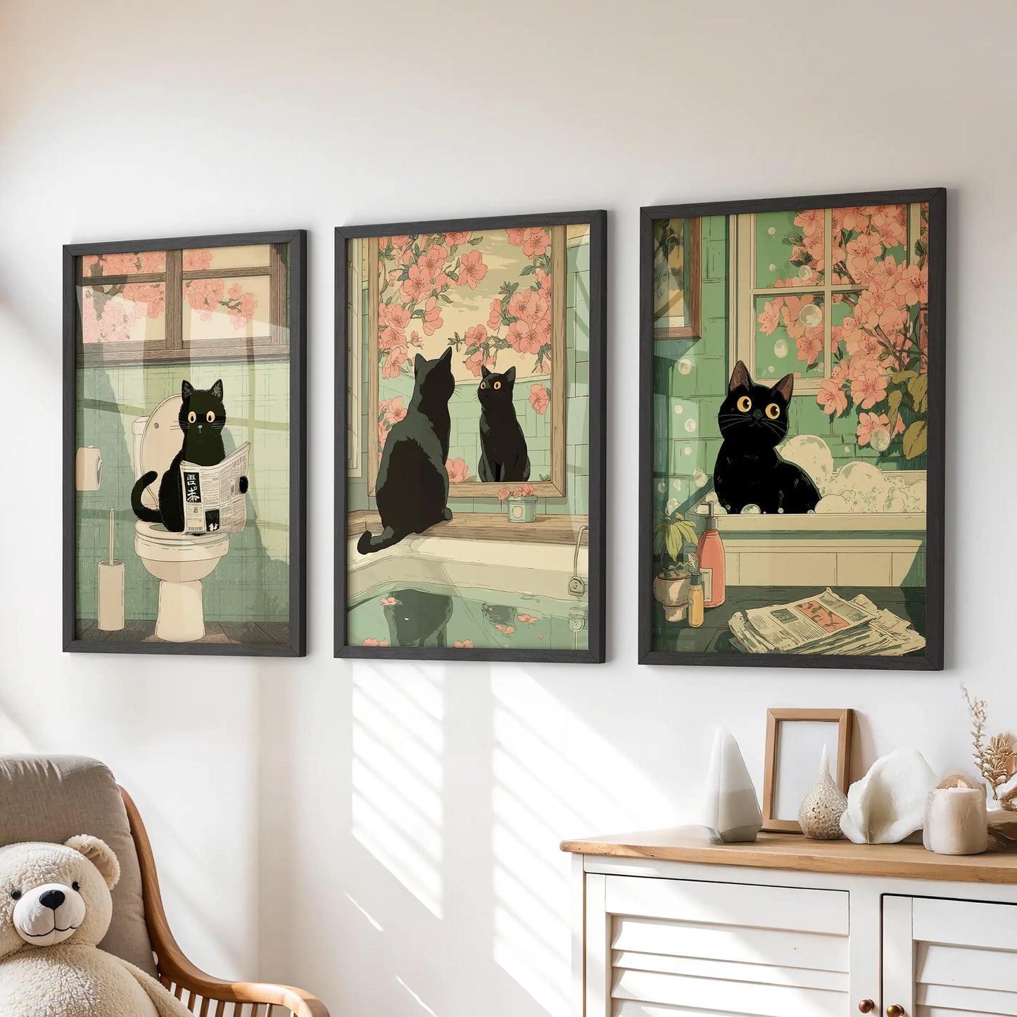 Funny black cat bathroom wall art, three-print set, placed above the chest of drawers in a children’s room with slim black frames.