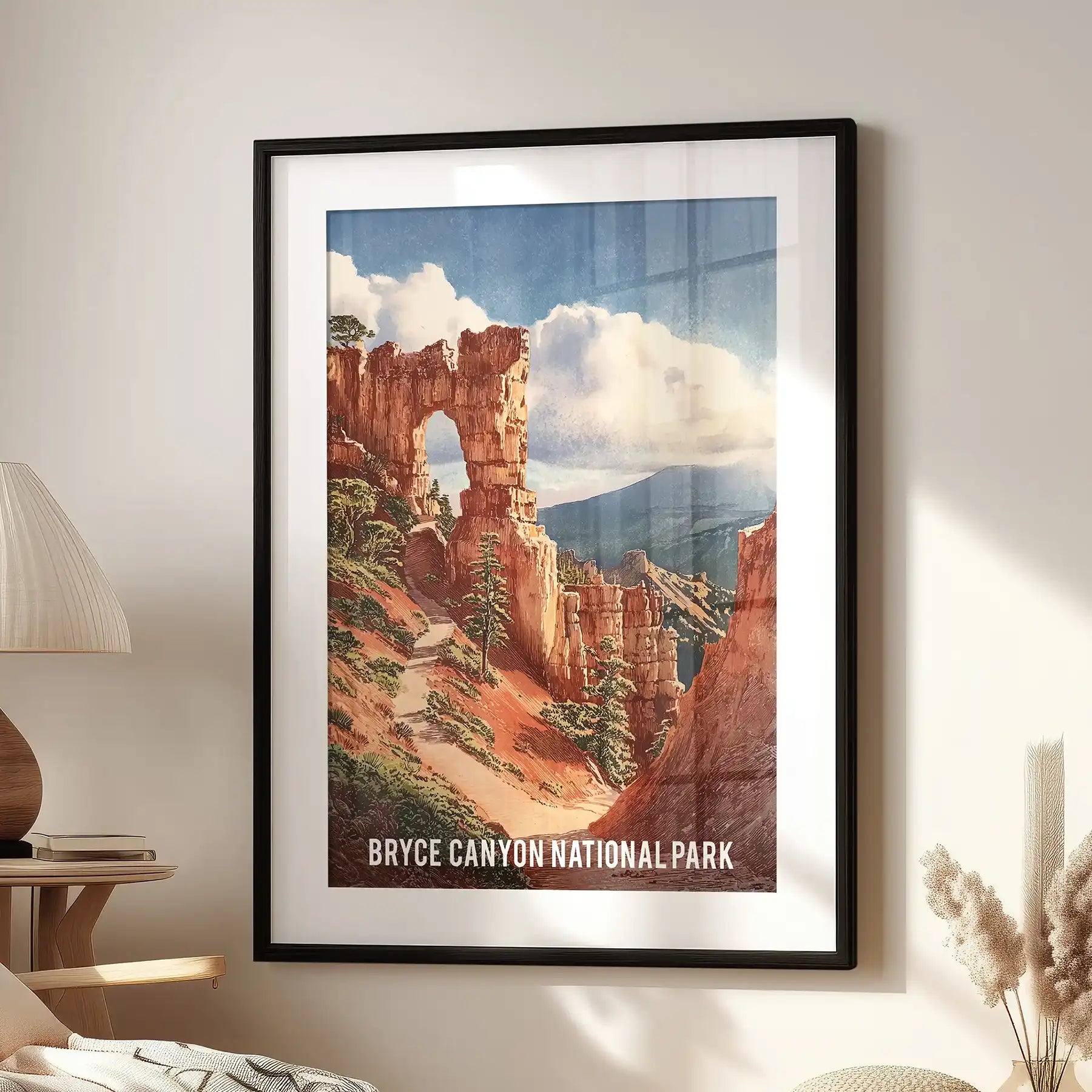 This wall poster of Utah’s sandstone hoodoos, framed in black mat, anchors the sitting room above a lounge chair and casts a soft canyon warmth.