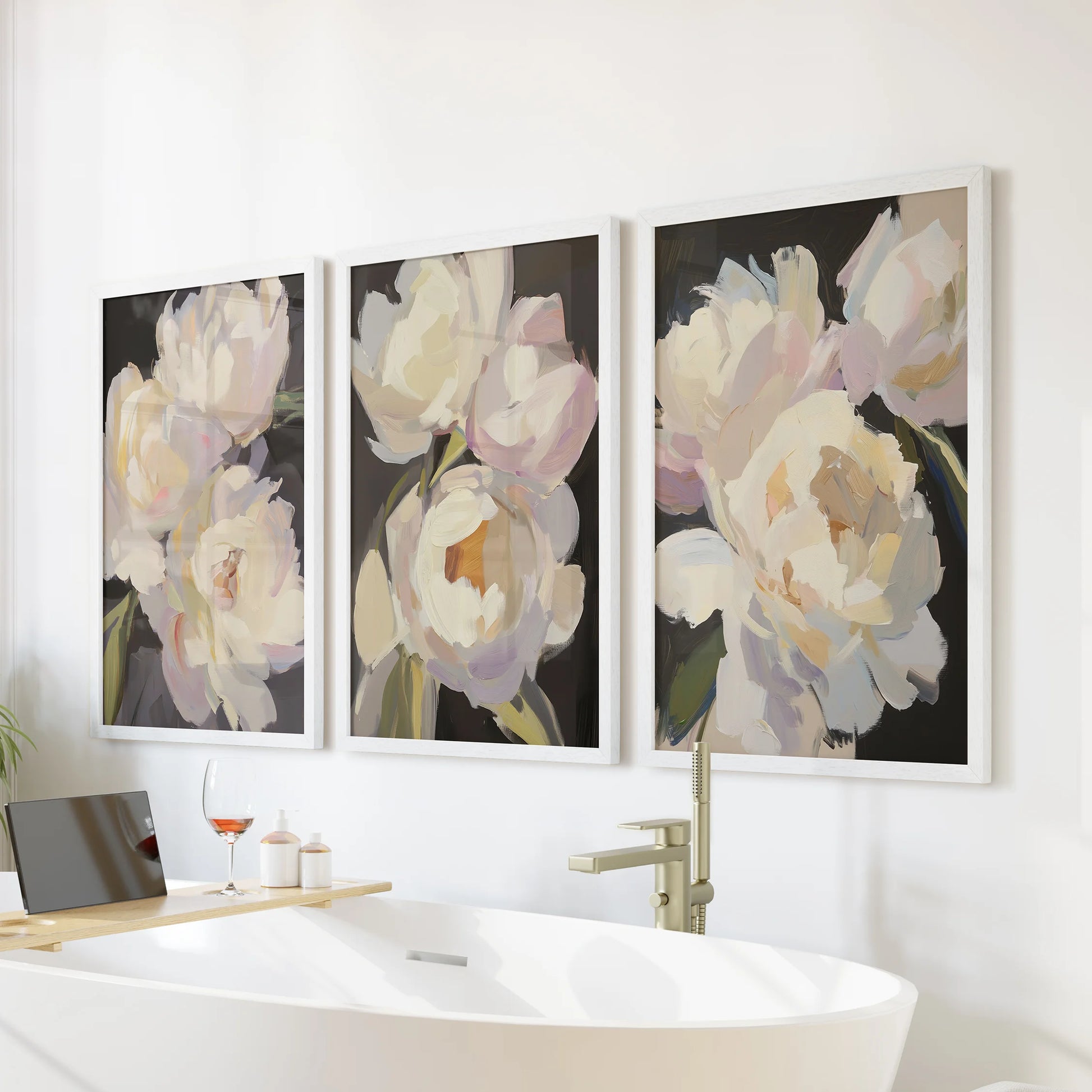 Pink and white peonies, a wall art trio set, float above the bathroom soaking tub in clean white frames, bringing romantic calm to the nook.