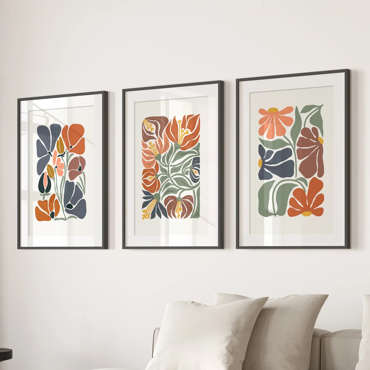 Boho floral art prints, set of 3 with black mats and frames, anchor the sitting room above the sectional with softly textured terracotta hues.