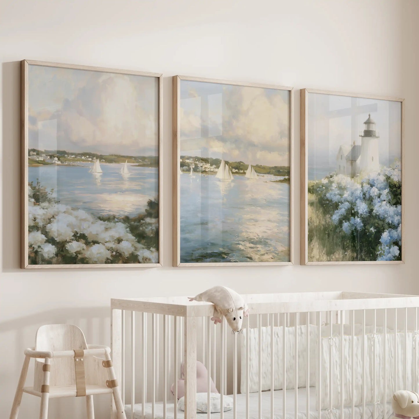 Seaside harbor view 3-piece gallery wall in light oak frames sets a calming maritime scene in the nursery over the crib.