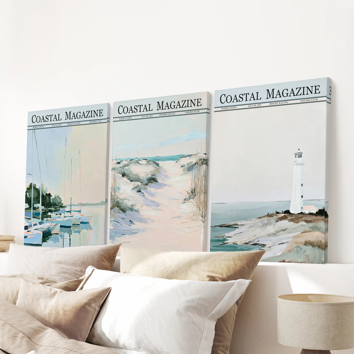 Coastal wall art trio on gallery-wrapped canvases, featuring a lighthouse, beach, sailboat, and dunes over a bedroom headboard.