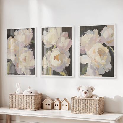 Over the playroom toy organizer, three white-framed vintage floral prints turn antique petals into cheerful, storytelling wall art.