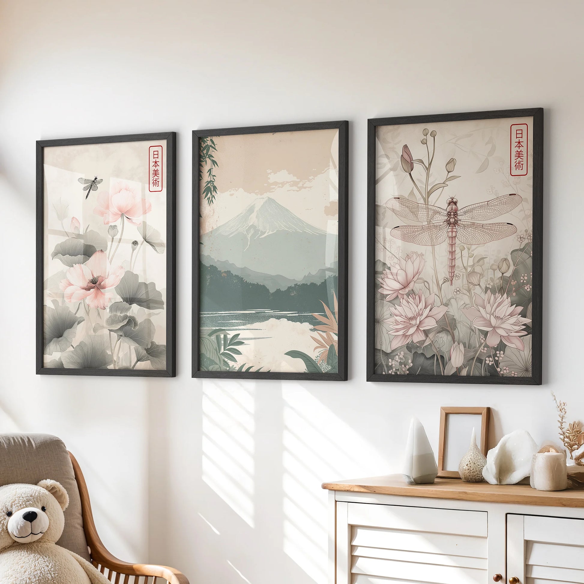 A set of three Japanese woodblock landscapes in slender black frames rests above the playroom dresser, adding soft, artful calm to the wall.