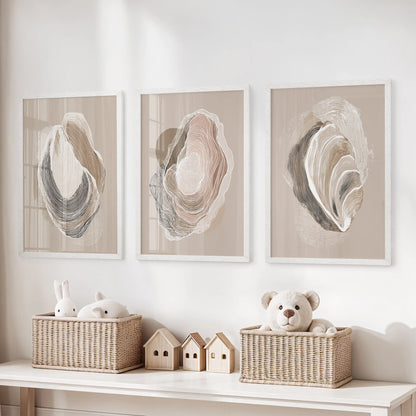 Vintage marine shell studies, set of three prints in bright white frames, perch over toy storage to bring a light coastal touch to the children’s room.