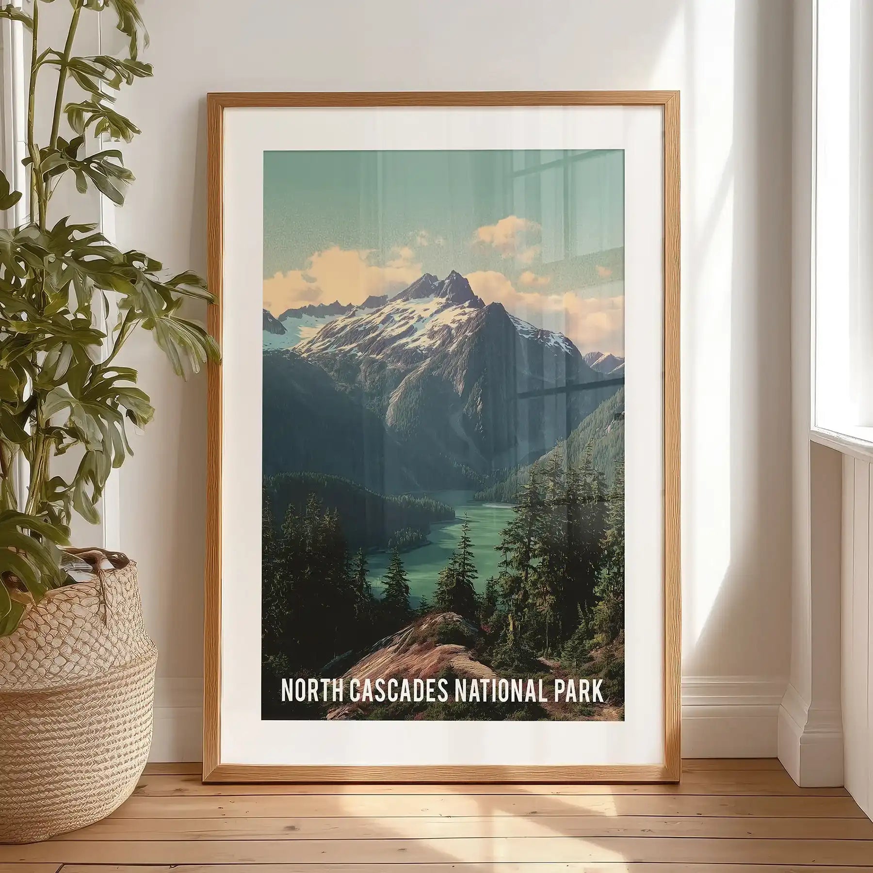 Framed in black with a mat, this vintage-style artwork print of mountains, lake, and pines stands on the bedroom floor as a bold wall accent.