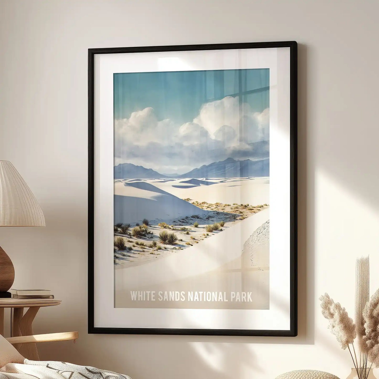 A statement art print of the Tularosa Basin hangs in a black mat frame above a window seat, giving the lounge a quiet, moody elegance.