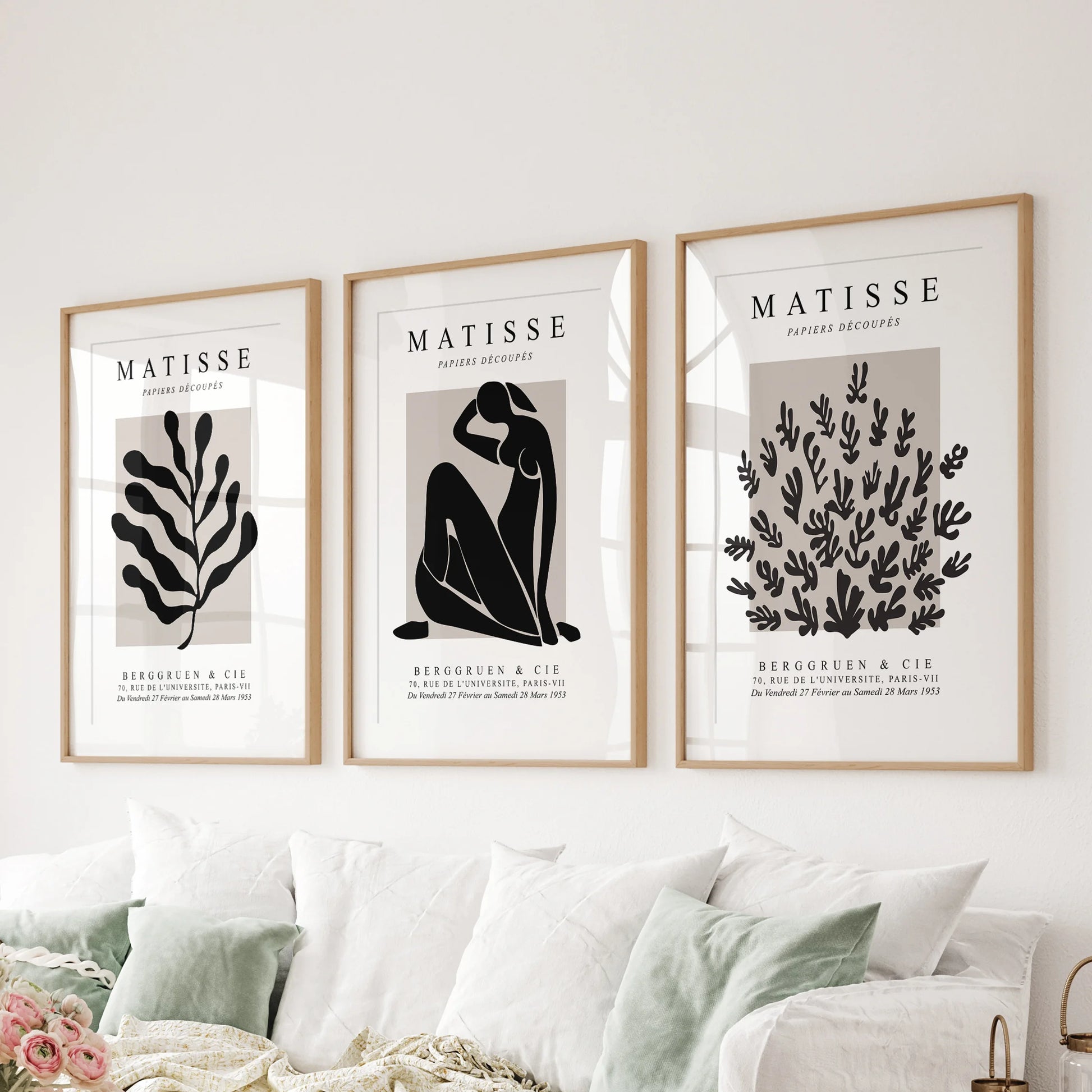 Minimal y2k posters, a wall art set of 3 on ready-to-hang canvas, centers the bedroom above the bed headboard with soft beige and black forms.