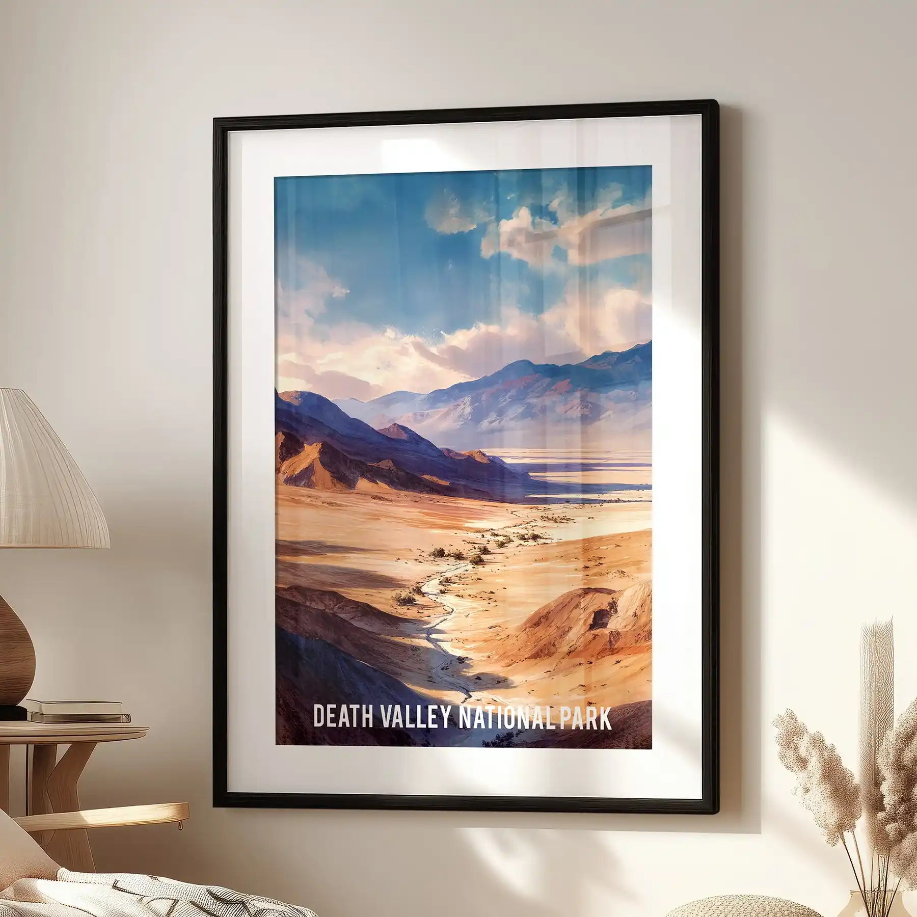 Sand dunes of Death Valley single panel poster set in a black frame with matting, hanging in a sitting room over the seating area with a retro travel vibe.