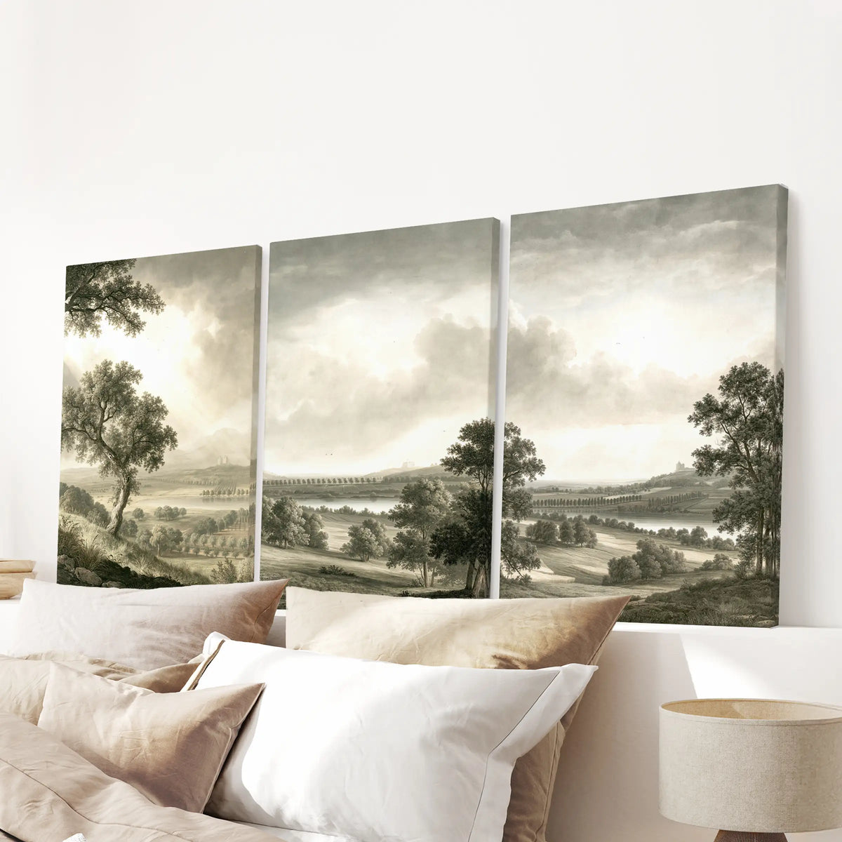Vintage nature wall art in a set of three frameless canvases, displayed over the headboard in a bedroom.