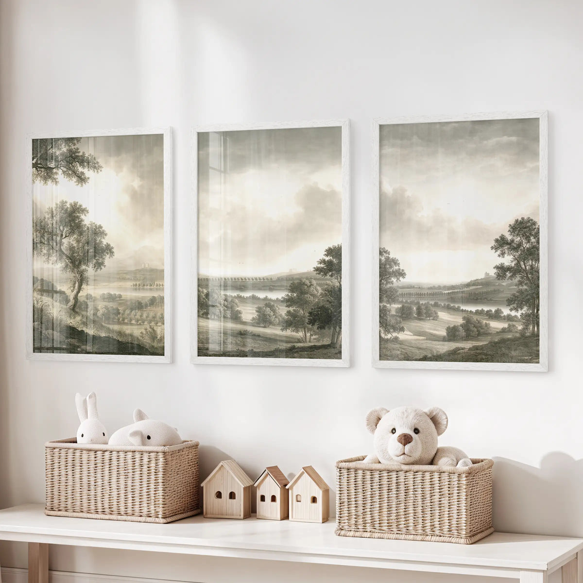 Vintage nature wall art in three white-framed pictures, displayed over a toy organizer in a playroom.