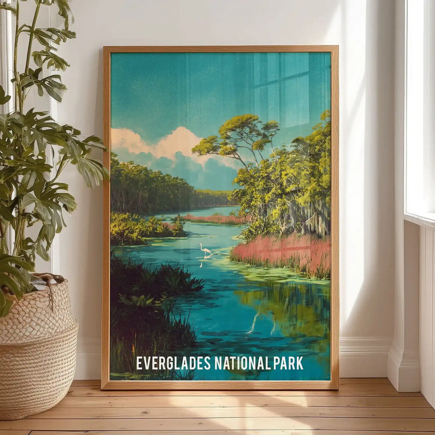 Everglades National Park landscape single poster leans by the bedroom window in a warm wooden frame, casual and sunlit against the wall.