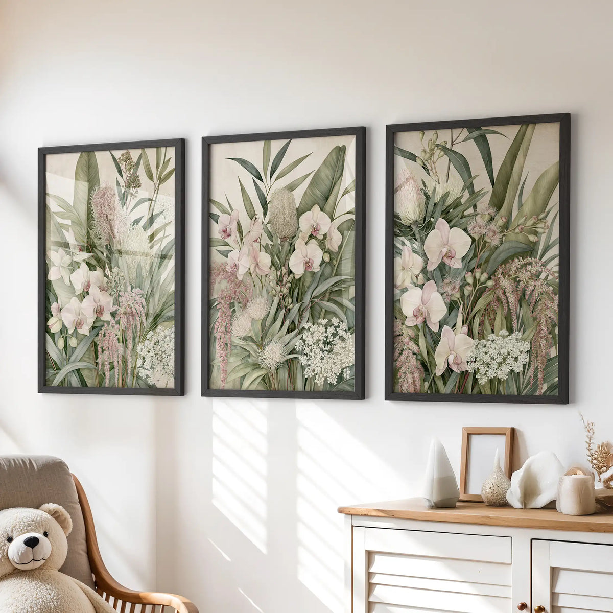 Pink orchid tropical wall art, a three-piece set in black frames above a dresser in a kids' room.