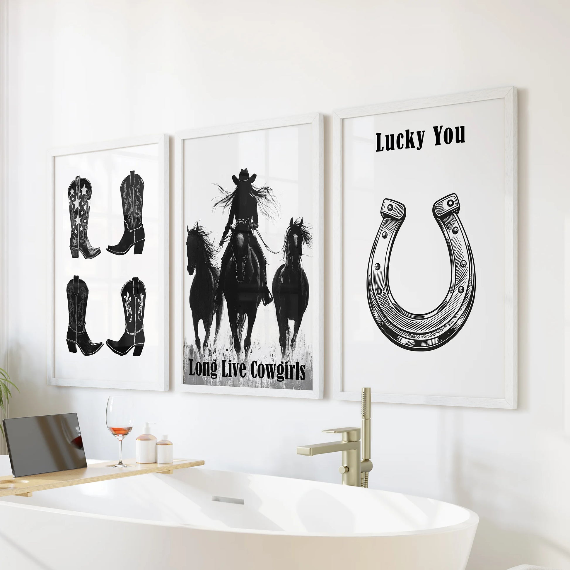 Three cowgirl boot illustrations in bright white frames stack above the tub, turning the bathroom wall into a light Western gallery.