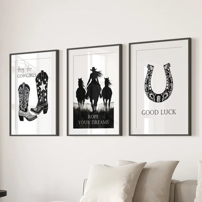 Vintage icon prints, matted and framed in black, form a three-panel wall set that brings timeless Western grit above the living-room sectional.