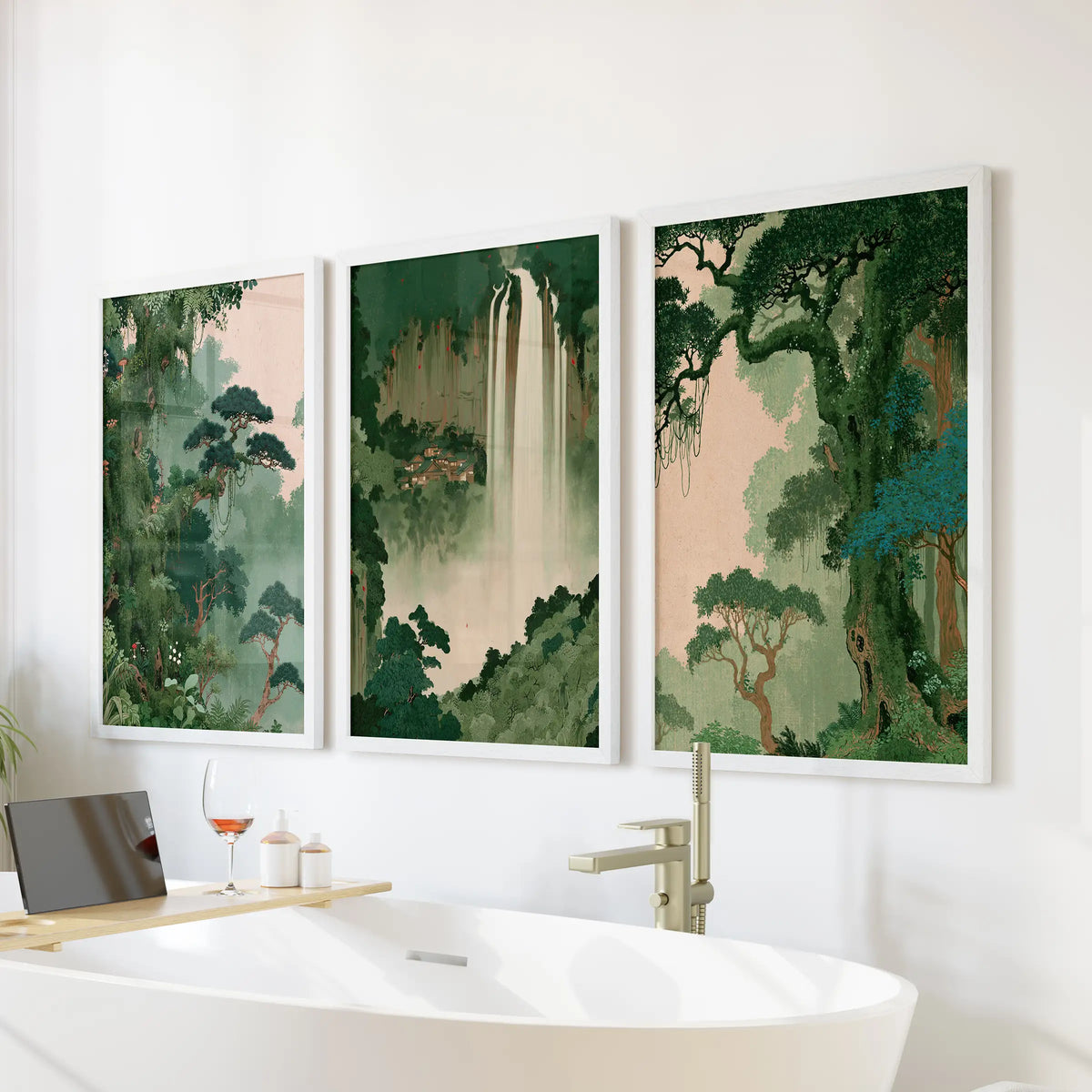 Vintage Japanese scenery wall art set of three white-framed pictures, arranged above a freestanding tub in a bathroom.