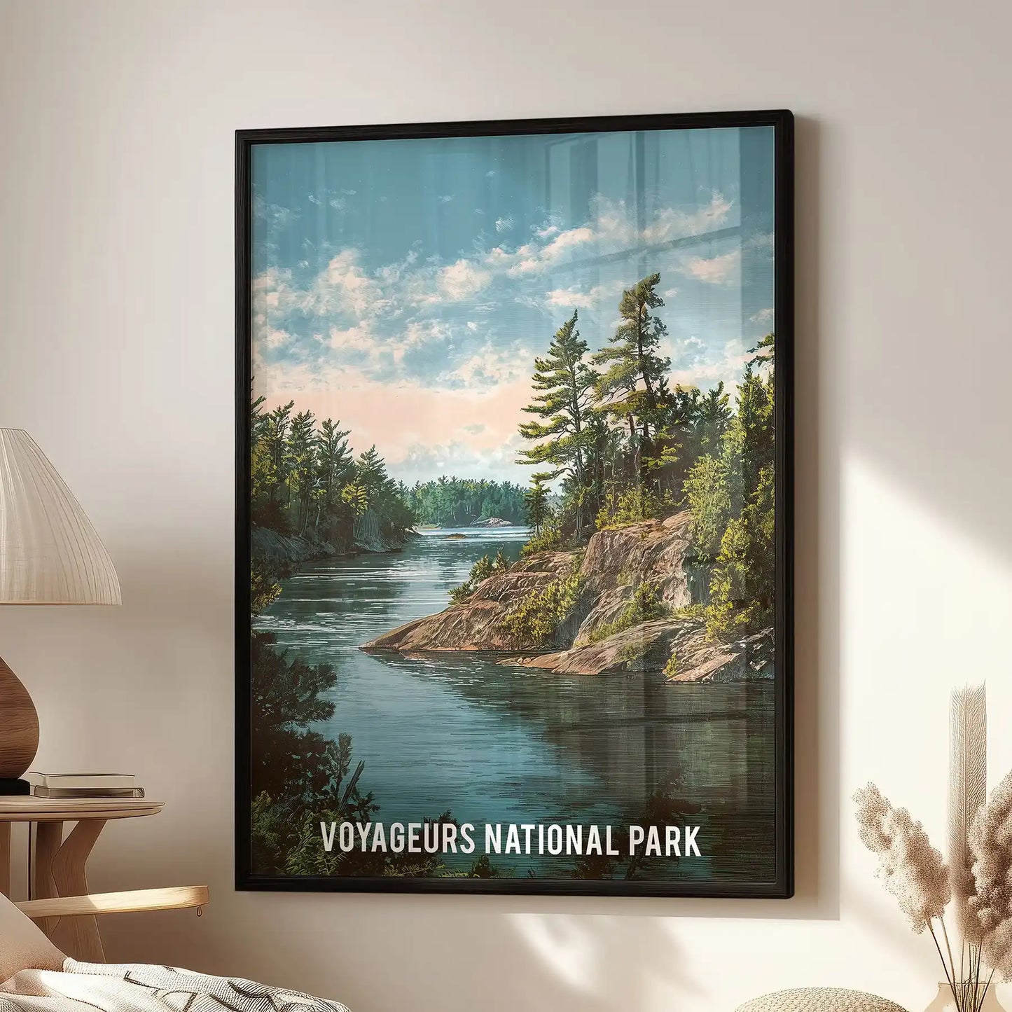 Pine forest and calm lake reflection, single-panel poster in a black frame hangs in the lounge above a window-side chair.