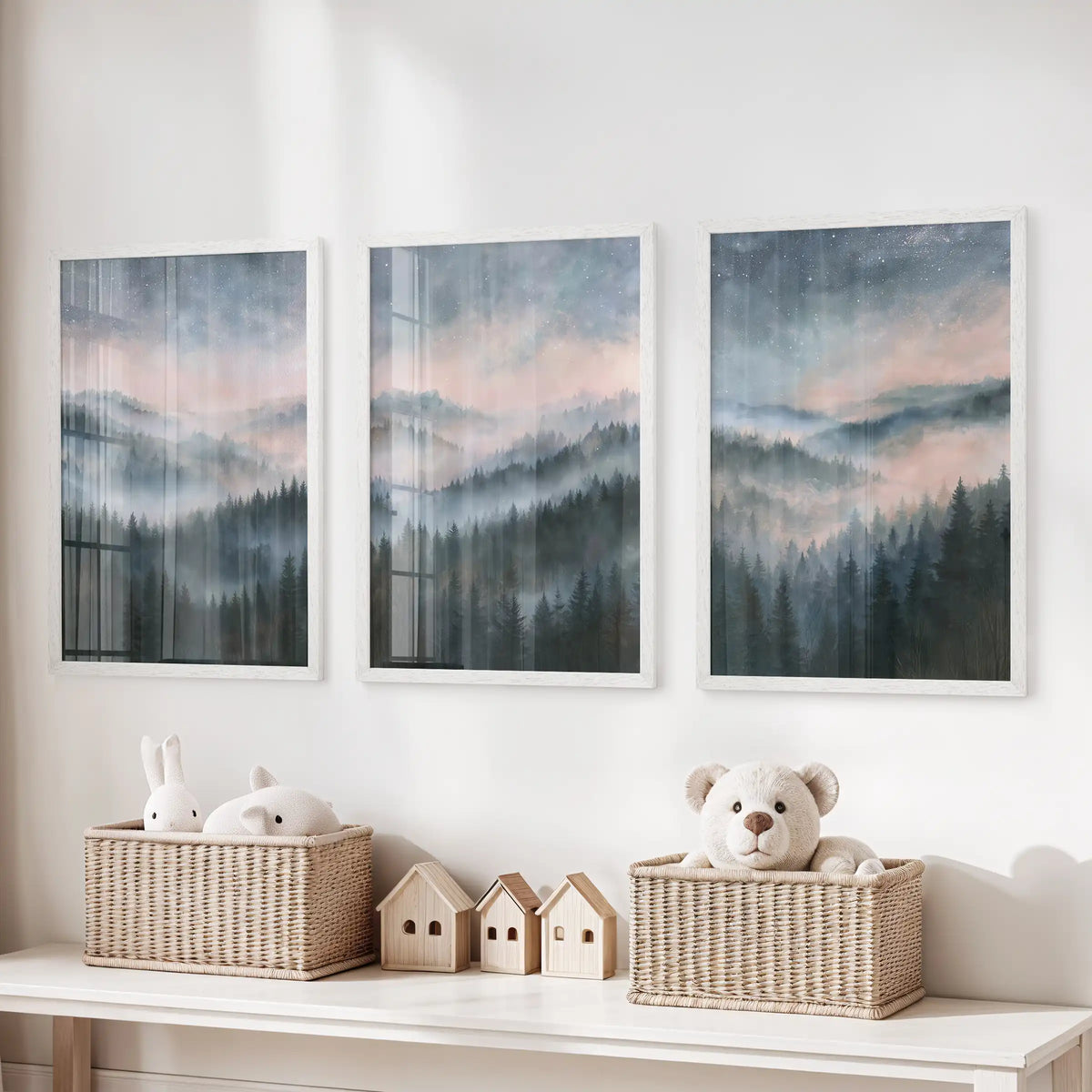 Blue watercolor landscape poster art, a set of 3 in white frames, hung above toy storage in the kids' playroom for a calm, airy note.