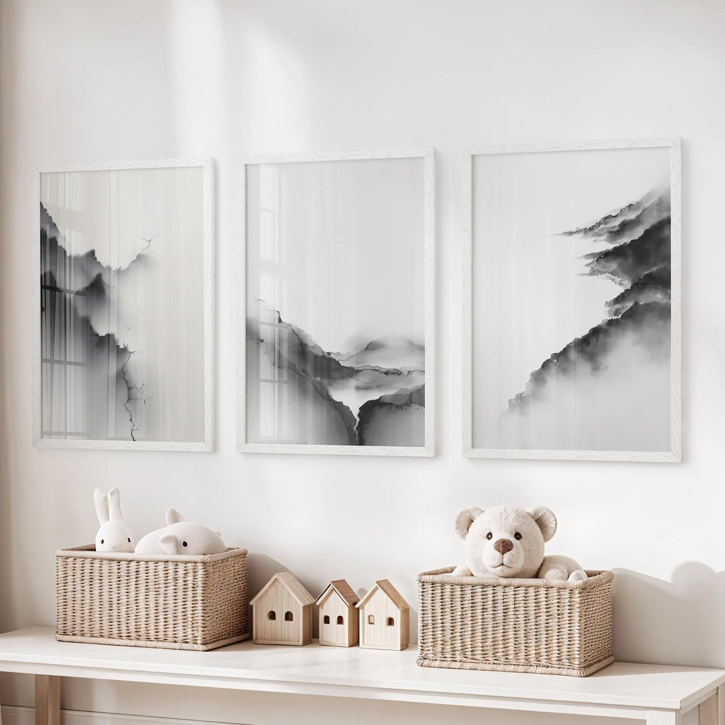 Mountain silhouettes, a white-framed three-piece wall hanging, tidy the children's room space above the storage bench.