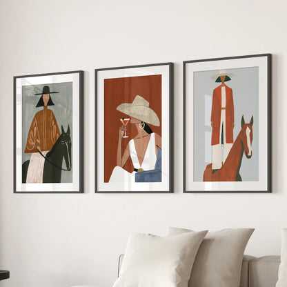 Western women with horses, set of three prints in black matted frames, warm the sitting room over the sectional sofa.