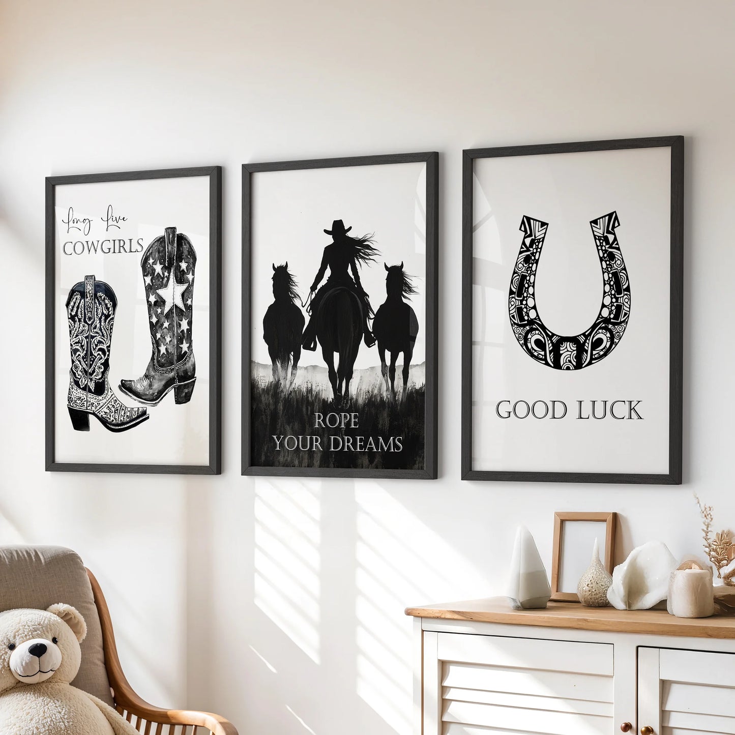 A framed trio of cowgirl slogan posters livens the kids’ playroom above the dresser, blending playful typography with easy Western style.