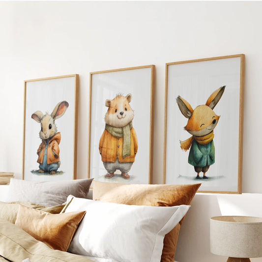 Woodland animals 3-piece art set in natural wood frames anchors the bedroom, centered above the headboard for a calm, gender-neutral feel.