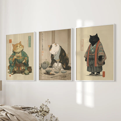 A trio of white-framed wall pieces with a soft Japandi cat illustration rests near the bed, creating an airy, minimalist bedroom accent.