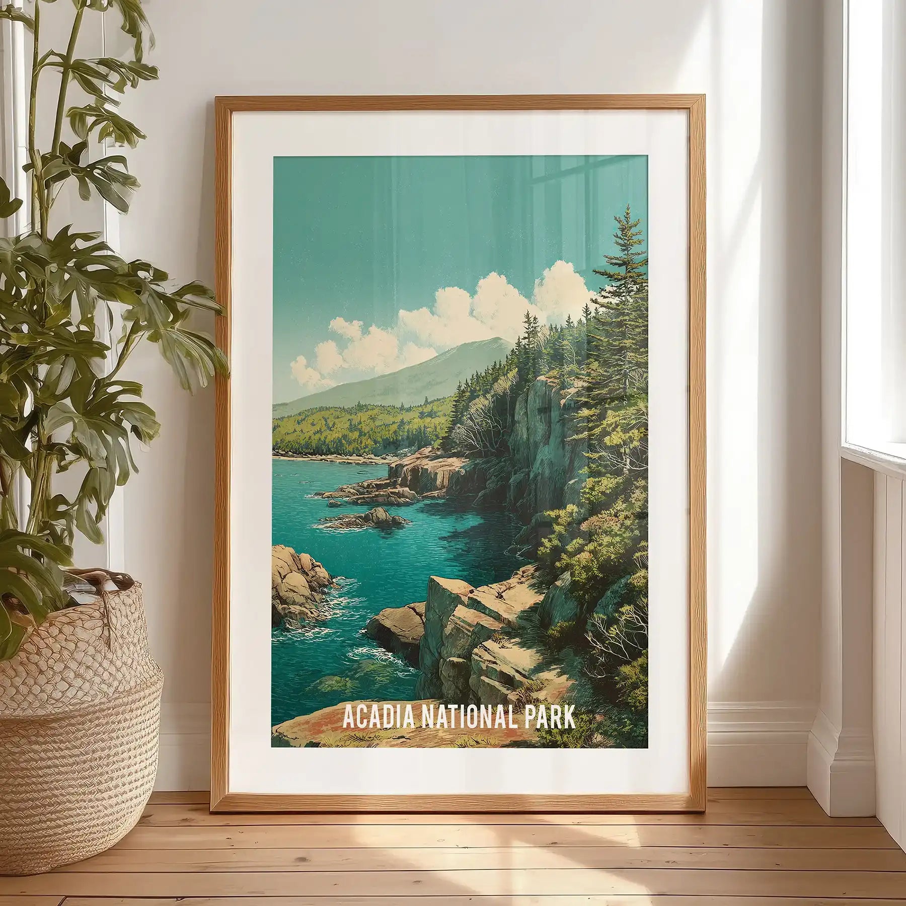 Maine Atlantic coast shoreline artwork print with a black frame and mat, propped on the bedroom floor by the window for a breezy, coastal feel.