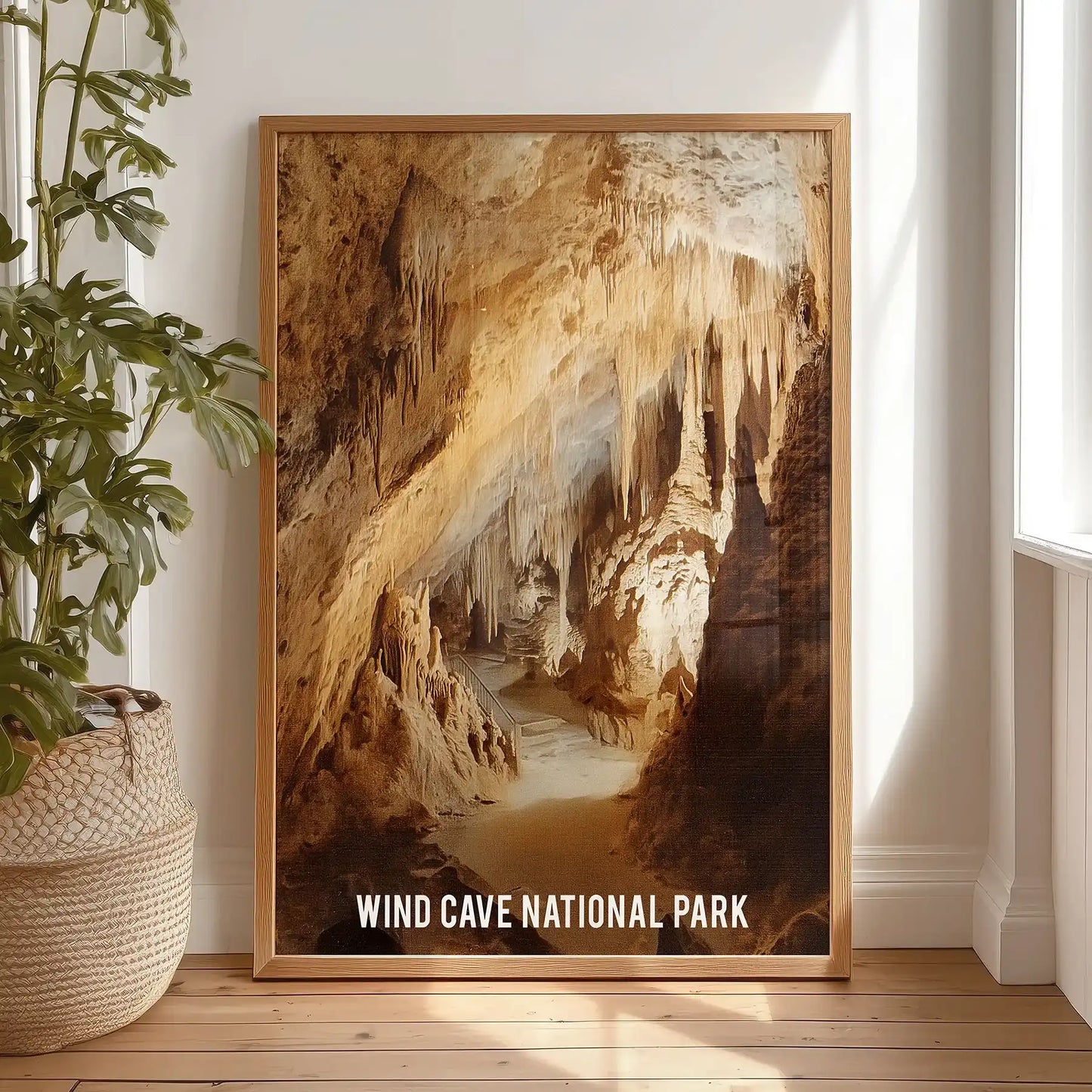 Wind Cave South Dakota art print, an edition in a light wood frame, is propped against the bedroom wall for a warm, natural accent.