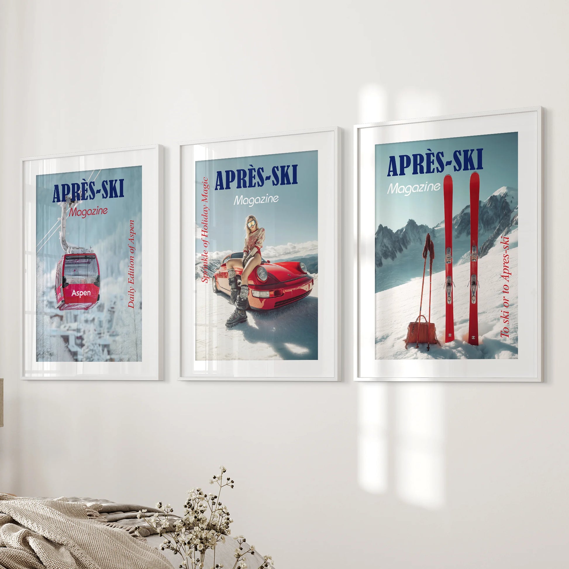 Aspen resort poster art, a matted white-framed print trio, freshens the bedroom bedside wall with retro typography and crisp mountain palette.