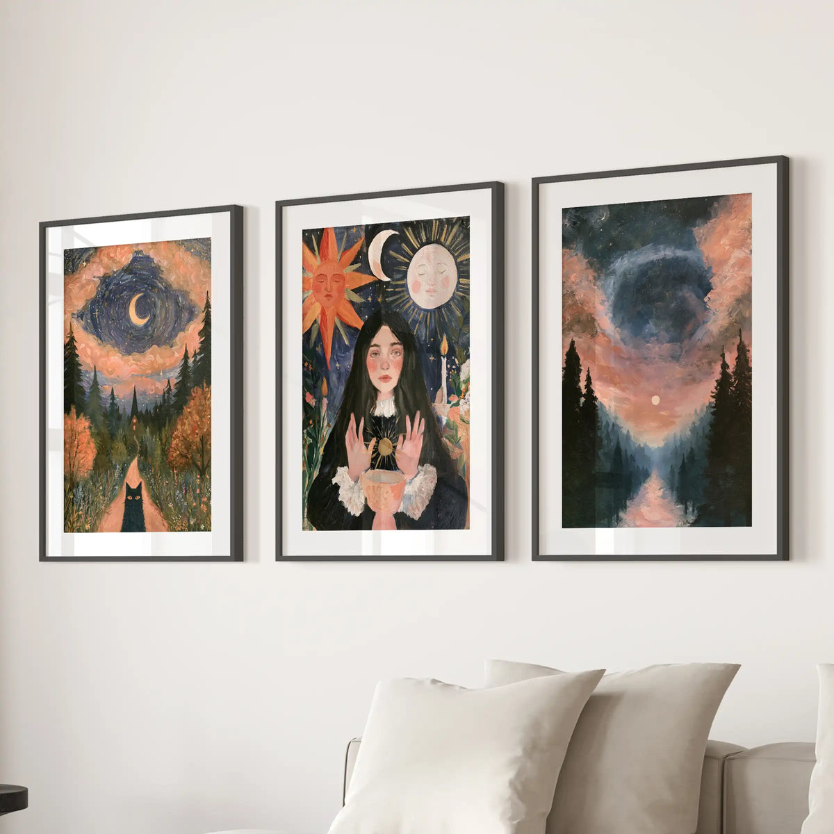 Celestial moon-and-sun print set of three arrives in black frames with wide mats, styled above the family-room couch for bold, dark-academia charm.