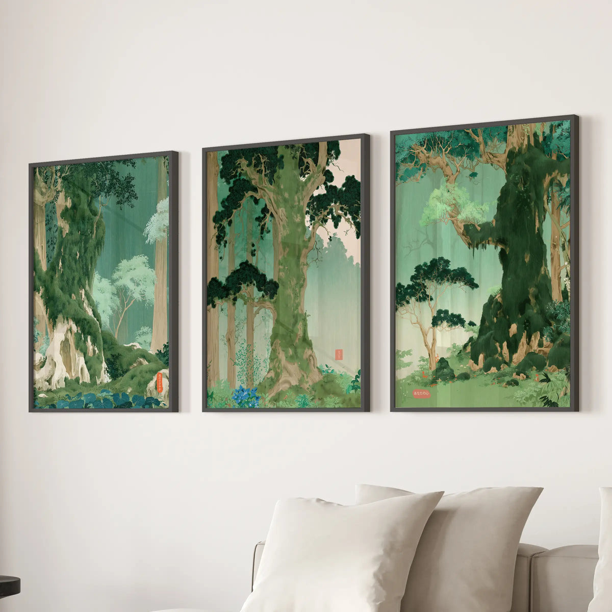 Woodblock-style landscape wall art, a set of three black-framed prints, is displayed above a sectional in the lounge.