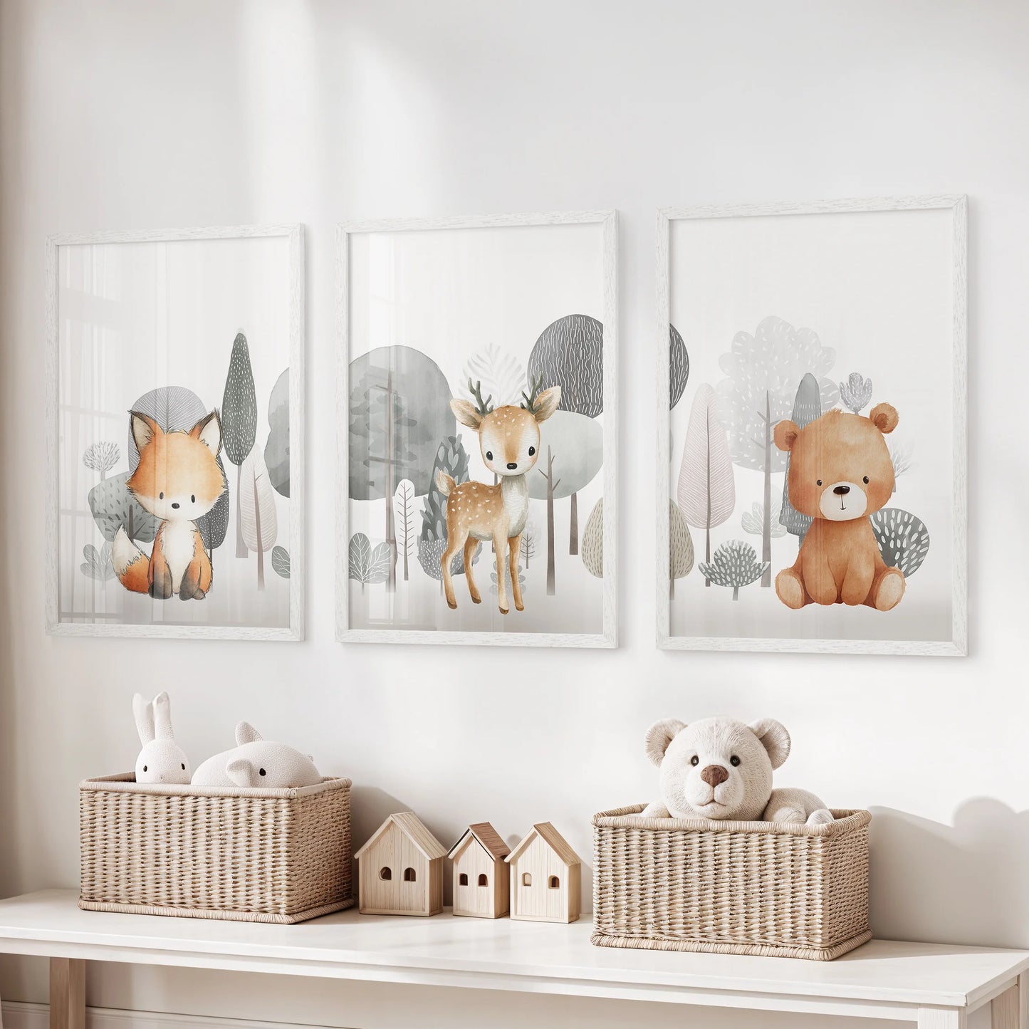 Three white-framed wall pictures of forest nursery animals lend playful warmth and balance to the child’s playroom.