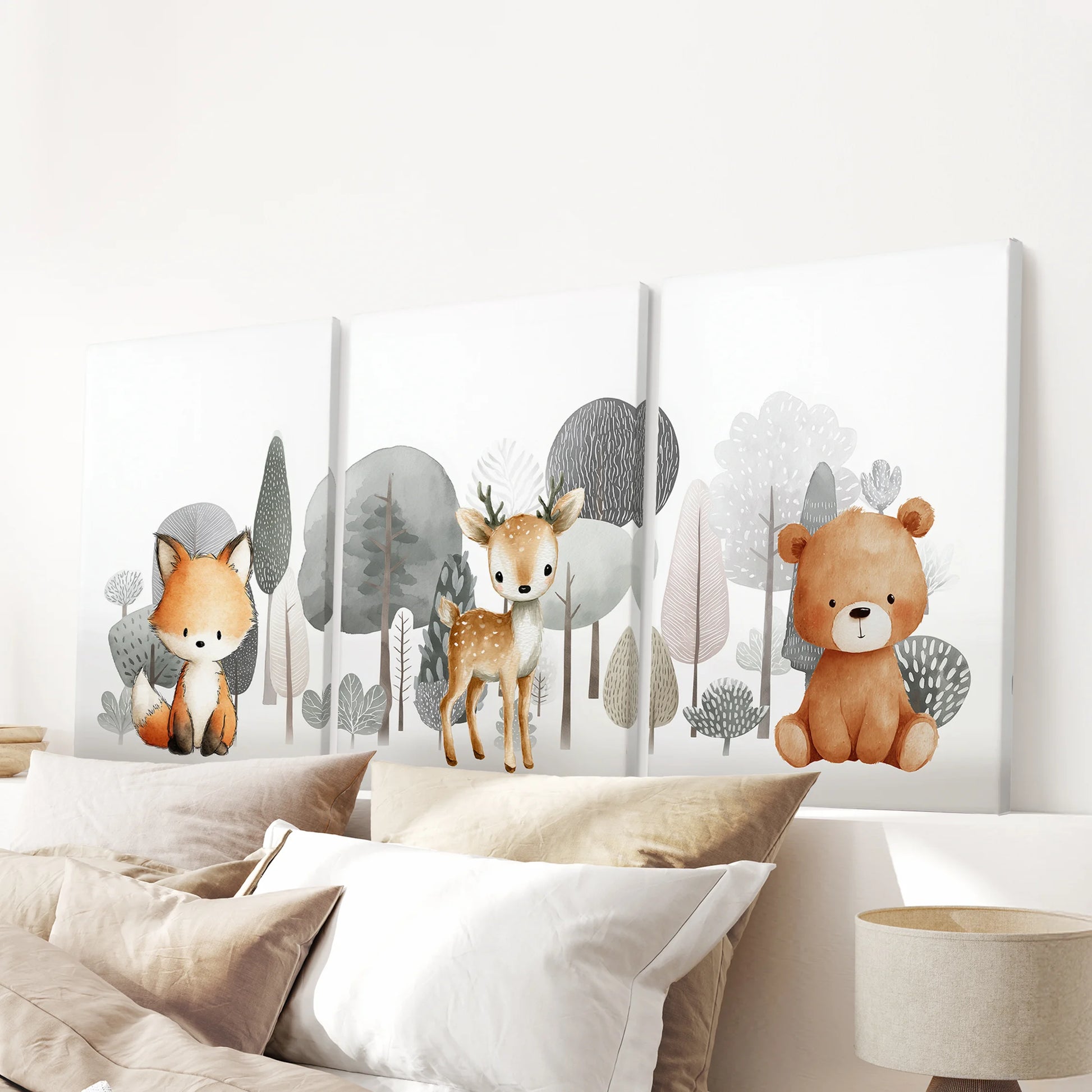 Forest nursery animals in a three-piece canvas wall hanging, gallery-wrapped for a clean look, span the bedroom wall above the headboard.